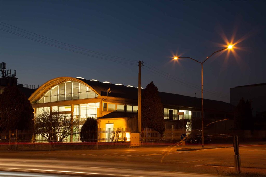 A night picture of the office of Fantetti, located in the industrial area of Vicenza, Italy. It's an industrial building that has been restored.